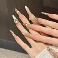 Faux ongles amande longs avec motif léopard érable, effet œil de chat et zircons - XS / Stiletto Fin