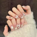 Unghie finte fatte a mano occhio di gatto bianco crema con punte French e fiocchi 3D - XS