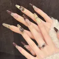 Faux ongles œil de chat marron avec strass de luxe et pointes French pailletées dorées - XS / Ovale étroit