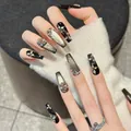 Glinsterende zwarte cat-eye plaknagels in lange trapeziumvorm met glitter en strassteentjes - XS / Lange Doodskist