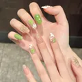 Detail of 3D resin flowers and gold wire on green floral press-on nails with pearls - XS / 2903-Short Oval