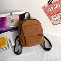 Brown corduroy mini backpack with front flap pocket and black straps for travel - Dark Brown