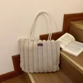 Plush beige faux fur tote bag with heart pattern and vertical striped fuzzy texture - Khaki