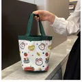 White canvas bucket bag with green handles and cute cartoon rabbit patterns - Green