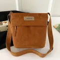 Brown corduroy crossbody bag with adjustable wide strap and vintage fashion patch - Brown