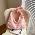 Light pink waffle texture hobo shoulder bag with adjustable strap on minimalist chair - No Pendant / Pink