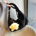 Large black waffle quilted shoulder bag with a yellow plush star pendant and adjustable strap - With Pendant / Black