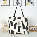 Grote canvas tote tas met zwarte geometrische patronen en stevige schouderbanden - Zwart
