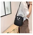 Detail of cute black nylon crossbody bag with white cartoon ghost face and adjustable strap - oo Expression / Black oo Expression