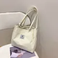 Creamy white corduroy tote bag with vertical stripes and silver metal rings - Off White