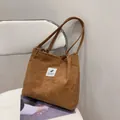 Brown corduroy shoulder tote bag for women featuring a minimalist square patch design - Brown