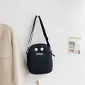 Graziosa borsa a tracolla in tela nera con viso a cartoni animati e tracolla regolabile - Stile Nero Con Occhi Rotondi