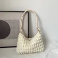 Chic cream-white popcorn textured shoulder bag with handcrafted knot strap detail - Off White