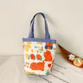 Canvas bucket tote bag with cartoon cat patterns and purple-blue handles for lunch - Tiger Blue