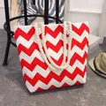 Canvas tote bag featuring red and white chevron pattern with thick rope handles - Red and White Zigzag Pattern