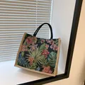 Florale Canvas-Tragetasche mit Vintage-Botanikmuster und schwarzen runden Henkeln - Schwarz
