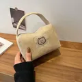Beige corduroy makeup bag with cute cartoon bear patch and zipper closure handle - Khaki