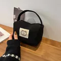 Black corduroy makeup bag with cute cartoon bear patch and soft carry handle - Black