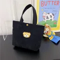 Mini black corduroy tote bag with yellow bear embroidery and gold metal snap button - Black