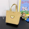 Mini yellow corduroy handbag for women featuring a cute embroidered bear patch detail - Khaki