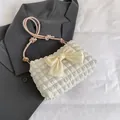 Cremefarbene Schultertasche mit gelber Schleife und rosa verknotetem Trageriemen - Rosa