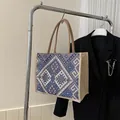 Ethnic bohemian tote bag featuring blue and pink geometric patterns and linen handles - Blue