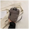 Vertical grey corduroy small crossbody bag with front zipper pocket and adjustable strap - Gray