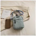 Light blue corduroy crossbody bag with adjustable strap and front zipper pocket - Green