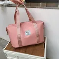 Pink large capacity travel bag in waterproof nylon with reinforced handles - Pink