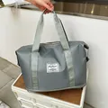 Large capacity dark grey waterproof travel duffel bag with reinforced handles in minimalist style - Gray