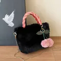 Black faux fur handbag with pink velvet handle and plush cherry charm on a gold chain - Black