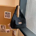 Minimalist black canvas tote bag with front pocket and fashion label in casual style - No Pendant / Black