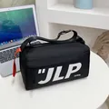 Minimalist black crossbody messenger bag with white JLP lettering and orange strap detail - Black