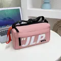 Pink waterproof nylon messenger bag with JLP logo and adjustable black shoulder strap - Pink