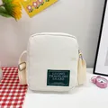 Mini beige corduroy crossbody phone bag with vintage patch and adjustable strap - White