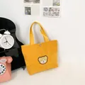 Mini-Tragetasche aus gelbem Cord mit Bären-Stickerei und stabilen Griffen - Gelb