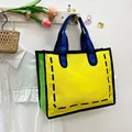 2D cartoon style canvas tote bag in yellow and blue with comic outline design - Yellow