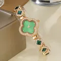 Montre à quartz pour femme avec cadran trèfle vert et bracelet chaîne dorée aux strass - Vert