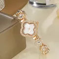 Montre quartz luxe pour femme avec cadran trèfle émeraude et strass brillants dorés - Blanc