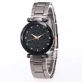 Detailed view of starry sky dial with diamond markers and faceted metal bezel on watch - Black