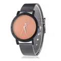 Detail of starry orange sand dial and dark grey mesh strap on minimalist quartz watch - Orange