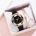 Dettaglio dell'orologio con quadrante stellato e bracciale in oro rosa con stella - Orologio Nero + Bracciale + Scatola