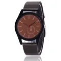 Detail of a men's quartz watch featuring a dark brown dial and metal mesh strap - Khaki