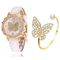 Détail de la montre papillon en or rose et du bracelet en perles serti de cristaux - Montre Blanche + Bracelet