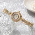 Orologio al quarzo dorato da donna con strass scintillanti su lussuoso sfondo argentato - Orologio da Polso al Quarzo / Oro