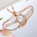 Detail of rose gold bracelet watch with crystal leaf accents and adjustable chain link - White