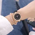 Dettaglio dell'orologio con quadrante cielo stellato oro rosa e bracciale a cuore - Orologio Nero E Bracciale Cuore