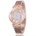 Detail of rose gold mesh watch band and round dial with sparkling floating crystals - Rose Gold