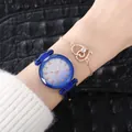 Detail of blue starry sky watch with leather strap and rose gold heart bracelet - Watch+Bracelet / Blue