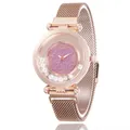 Detail view of rose gold mesh strap watch with sparkling glitter dial and moving rhinestones - Pink